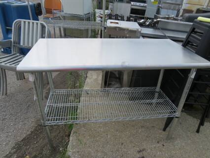 One Stainless Steel Table With A Metro Under Shelf. 49.5X24X36