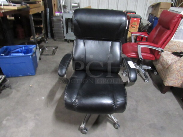 One Black Pleather LaZBoy Office Chair On Casters.