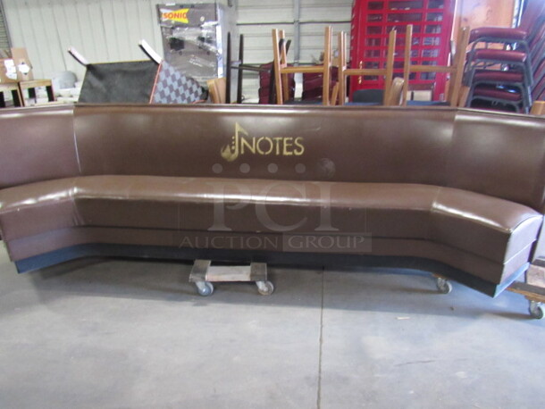 One Brown Cushioned Booth/Waiting Bench. 130X26X37