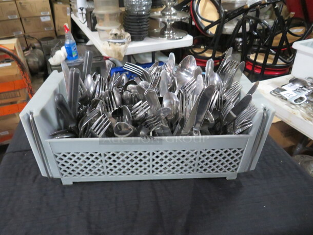 One Dishwasher Flatware Rack Full Of Assorted Flatware.