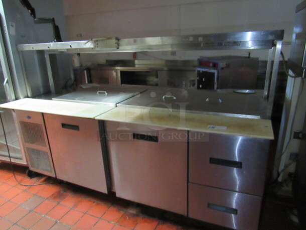 One Randell 2 Door, 2 Drawer Refrigerated Prep Table With Over SHelf And 2 Racks. Model# CUSTOM. 120/208 Volt. 84X51.5X56