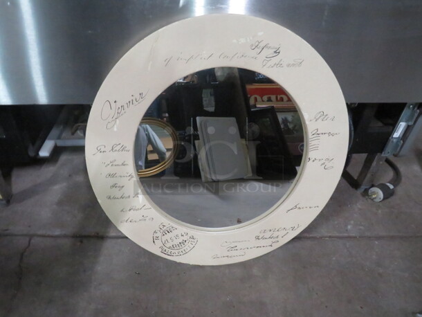 One 24 Inch Round Framed Mirror.