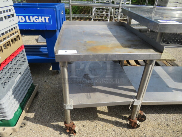 One Stainless Steel Equipment Table With SS Under Shelf On Casters. 25X28X31
