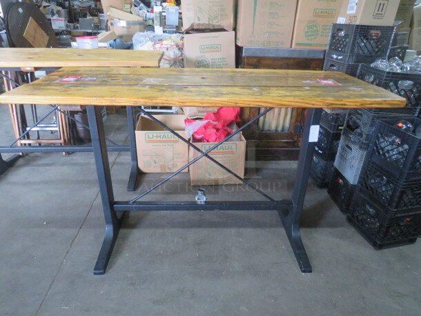 One Wooden Table Top, With An Umbrella Hole,  On A Bar Height Black Industrial Base. 72X28X42