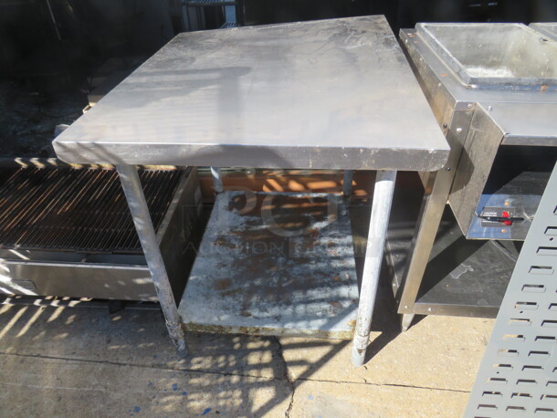 One 48X30X34 Stainless Steel Table With Under Shelf, On Casters. 