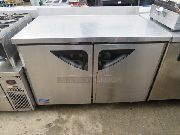 One Turbo Air 2 Door Under Counter Refrigerator With 2 Racks, On Casters.  Model# TWT-48SD. 115 Volt. 48X31X40