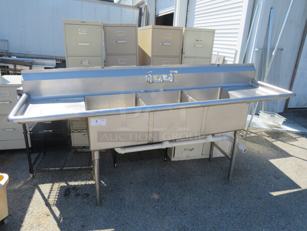 One Stainless Steel 3 Compartment Sink With Faucet, No Sprayer, And R/L Drain Boards. 90X25X43.5. SInk 18X18X11. - Image 1 of 2