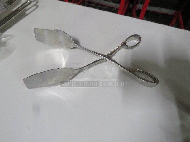 One Stainless Steel 10.5 Inch Tong.  - Image 1 of 1