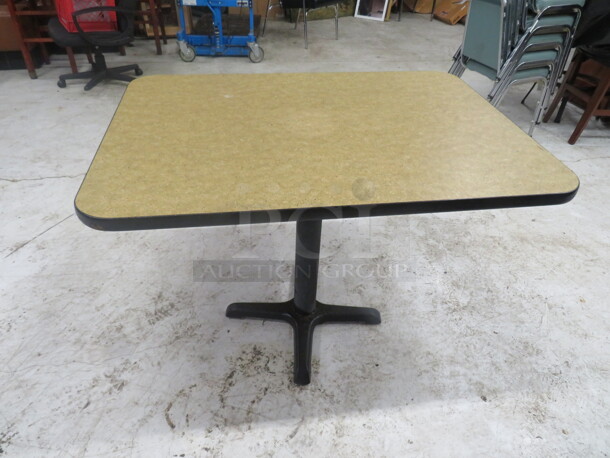 One Beige Laminate Table Top On A Pedestal Base. 42X30X29
