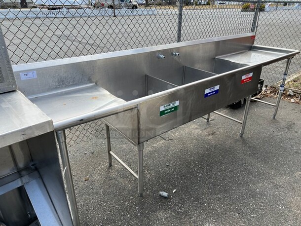 Stainless Steel Commercial 3 Bay Sink w/ Dual Drainboards. 126x27x44. Bays 22x24x12. Left Drainboard 22x24x2. Right Drainboard 35x24x2