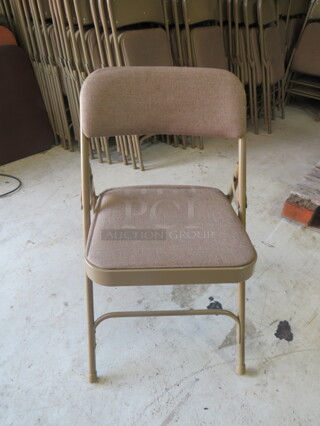 Beige Folding Chair With Cushioned Seat And Back. 10XBID