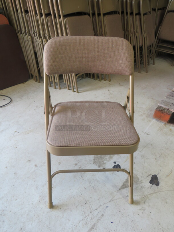 Beige Folding Chair With Cushioned Seat And Back. 10XBID - Item #1110957