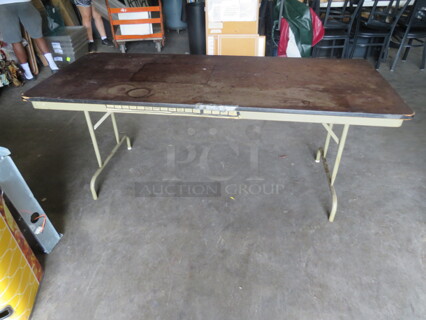 One Norwood Folding Table With Laminate Top And Metal Legs. 72X30X29