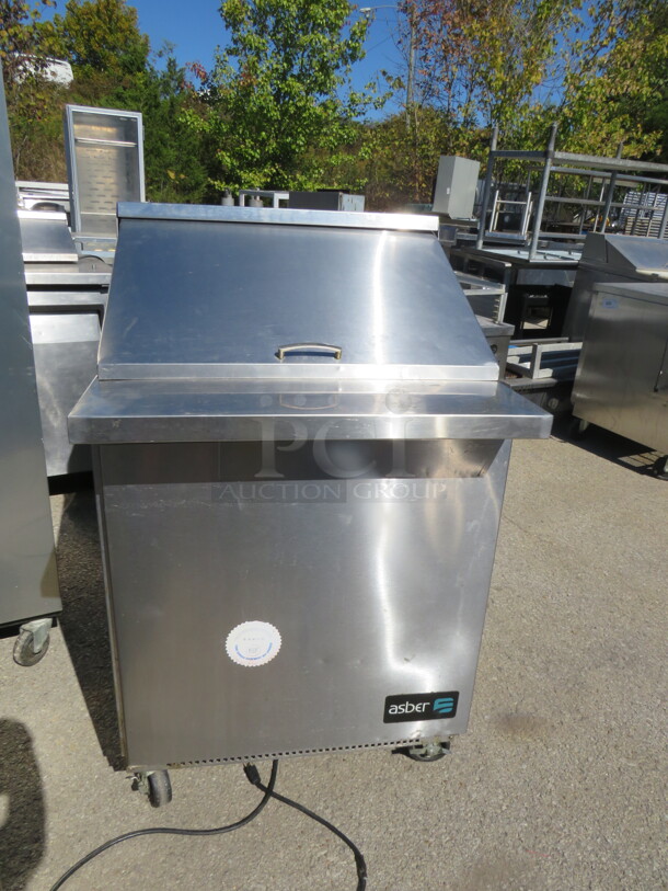 One ASber 1 Door Refrigerated Prep Table On Casters. Model# APTM27-12. 115 Volt. 27X34.5X46.5. - Image 1 of 2
