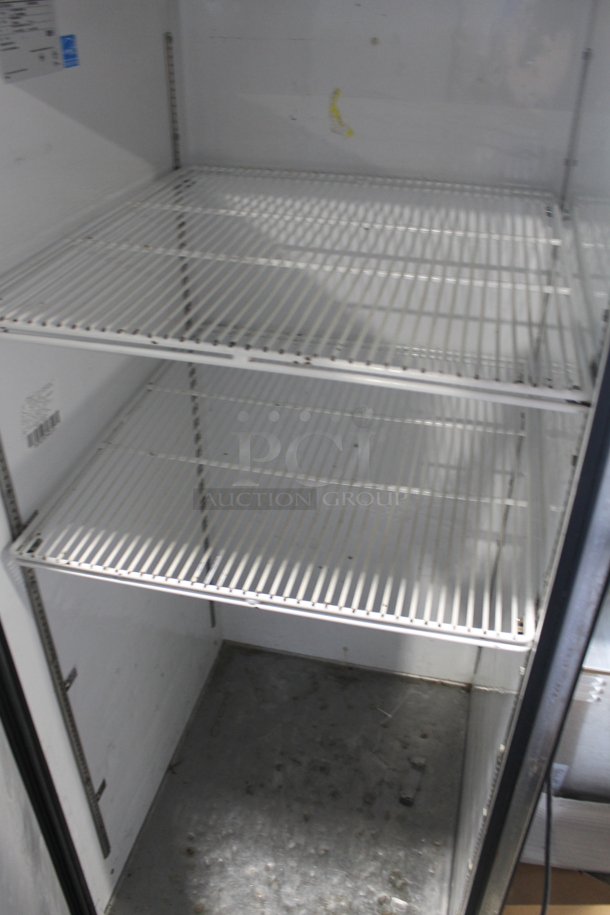 2015 True TG1R-1S ENERGY STAR Stainless Steel Commercial Single Door Reach In Cooler w/ Poly Coated Racks on Commercial Casters. 115 Volts, 1 Phase. Tested and Working! - Image 3 of 4