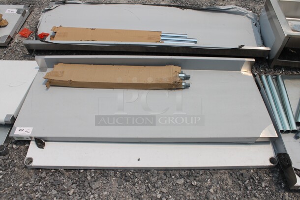 BRAND NEW SCRATCH AND DENT! Regency 600TB2460G Commercial Stainless Steel Disassembled Work Table With Backsplash, Undershelf And Galvanized Legs. - Image 1 of 6