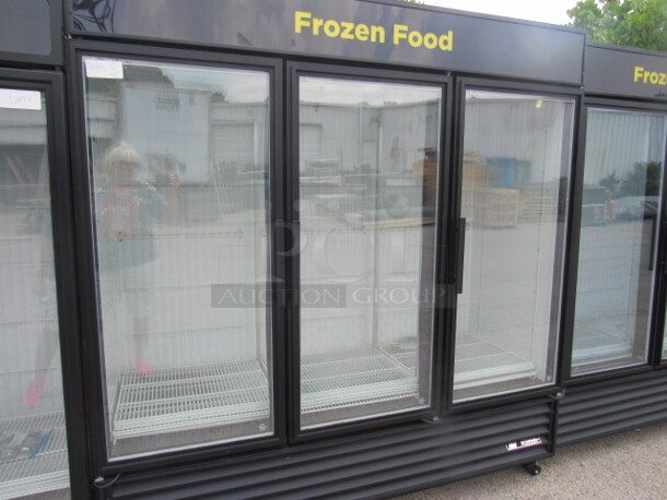 One True 3 Door Glass Display Freezer With 12 Racks, On Casters. Model# GDM-72F-LD 115/208-230 Volt. 1 Phase. Not Tested.  78X30X82