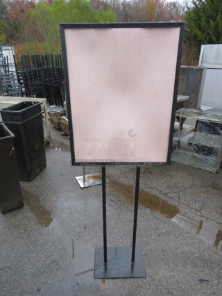 One Black Metal Floor Sign.