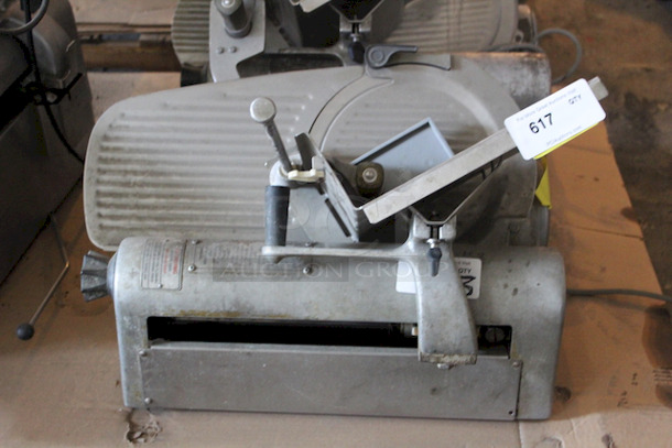 SOLID! Hobart 1612E Deli Slicer, Working When Tested Slice Thickness: 1 1/4". Knife Diameter: 11 3/4". Capacity: Food up to 12"W or 7 1/2" in diameter. Volts: 115. Hertz: 60. Single Phase. Amps: 4.5. Horse Power: 1/4; 23-5/8"W x 26-1/4"D x 21-1/4"H - Image 1 of 4