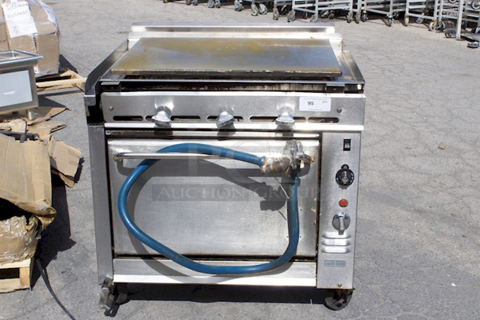 Montague Legend 36" Heavy Duty Gas Range With 36" Plancha Top and Convection Oven Base. In Working Order