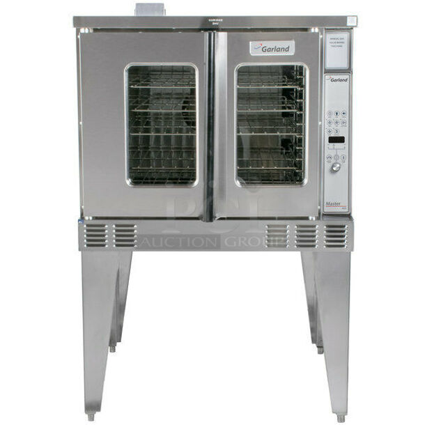 BRAND NEW! 2021 Garland Model MCO-GS-10 Stainless Steel Commercial Natural Gas Powered Full Size Convection Oven w/ view Through Doors, Metal Oven Racks and Thermostatic Controls. Stock Picture Used For Gallery. Does Not Include Legs. 60,000 BTU. 38x38x33 - Image 1 of 10