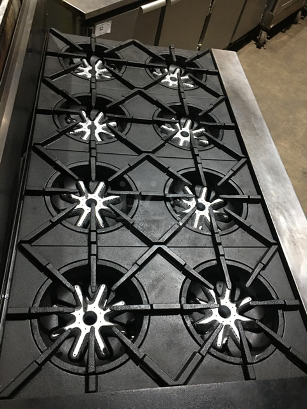 AN ANMAZING FIND! Garland 8 Burner Stove! With Left Side Hot Plate! With Back Splash! With 2 Full Size Ovens Underneath! With Metal Oven Racks! All Stainless Steel! On Casters! - Image 5 of 10