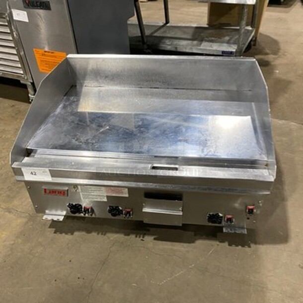 Lang Commercial Countertop Natural Gas Powered Mirror Shine Polish Top Flat Top Griddle! With Back And Side Splashes! All Stainless Steel! On Small Legs! Working When Removed!
 - Image 1 of 8
