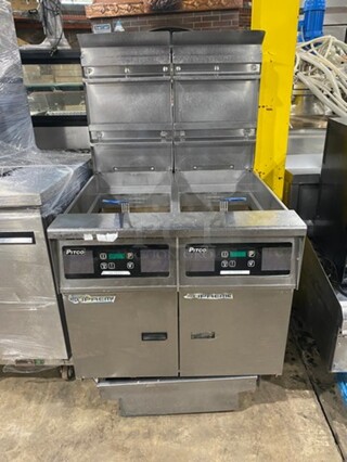 DON'T MISS OUT! AMAZING! Pitco Frialator Stainless Steel Commercial Natural Gas Powered 2 Bay Deep Fat Fryer w/2 Metal Fry Baskets! Oil filter System. On Commercial Casters! MODEL SSH55 Serial G18CE021564. 