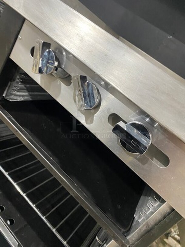 Commercial Natural Gas Powered 6 Burner Stove With Right Side Flat Griddle! Griddle Has Side Splashes! With Raised Back Splash And Salamander Shelf! With 2 Oven Underneath! Metal Oven Racks! All Stainless Steel! On Casters! - Image 10 of 11