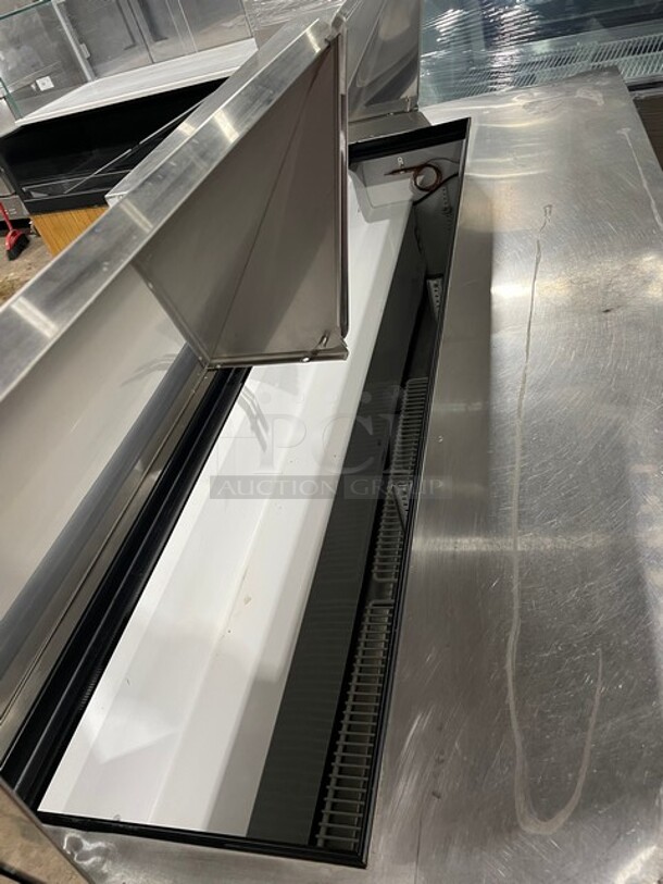 True Mega Top Sandwich/Salad Prep Table! All Stainless Steel! With 3 Door Refrigerated Storage Underneath! With poly Coated Racks! 115V 1 Phase! On Casters! Model: TSSU-72-18 SN: 1-4477571!  - Image 6 of 11