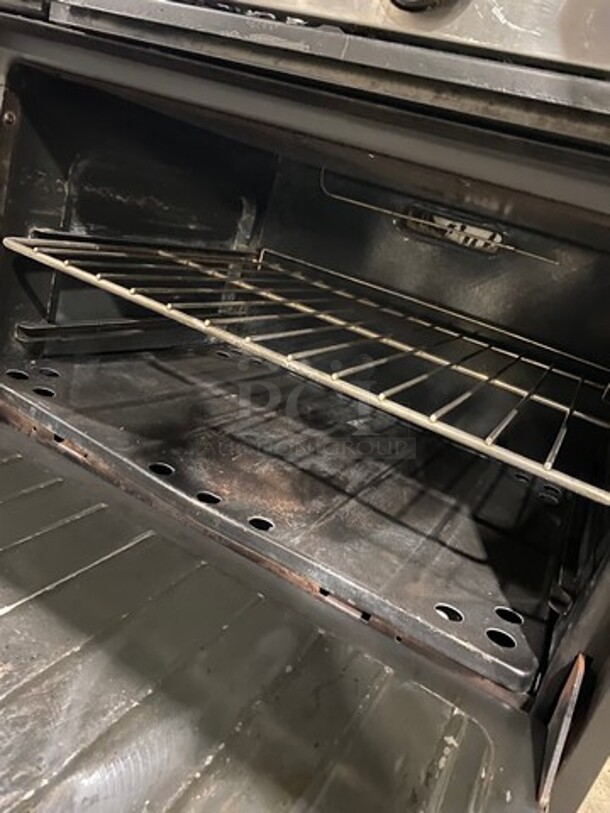 AMAZING FIND! Garland Natural Gas Powered 10 Burner Stove! With 2 Full-Sized Ovens! With Metal Oven Racks! With Raised Back Splash & Salamander Shelf! Stainless Steel! On Casters! - Image 8 of 11
