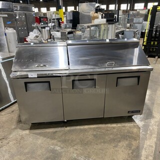 True Commercial Refrigerated Mega Top Sandwich Prep Table! With 3 Door Storage Space Underneath! Poly Coated Racks! All Stainless Steel! On Casters! Model: TSSU7218 SN: 14477571! 115V 60HZ 1 Phase!