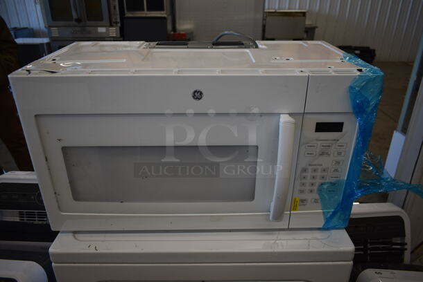 BRAND NEW SCRATCH AND DENT! General Electric GE JVM3160DF Metal Microwave Oven. - Image 1 of 9