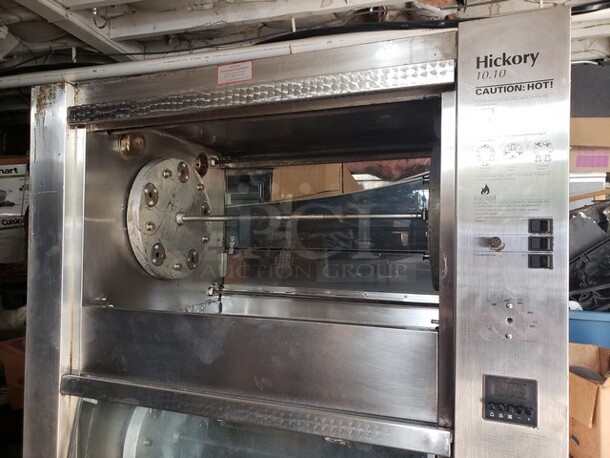 Hickory 10.10E Electric Rotisserie Oven on Casters! Left side of the oven has a small dent. Missing one knob and one knob is broken and needs to be replaced. 

Motor 120V, 1PH
Heating Elements 208V, 3PH - Image 3 of 10