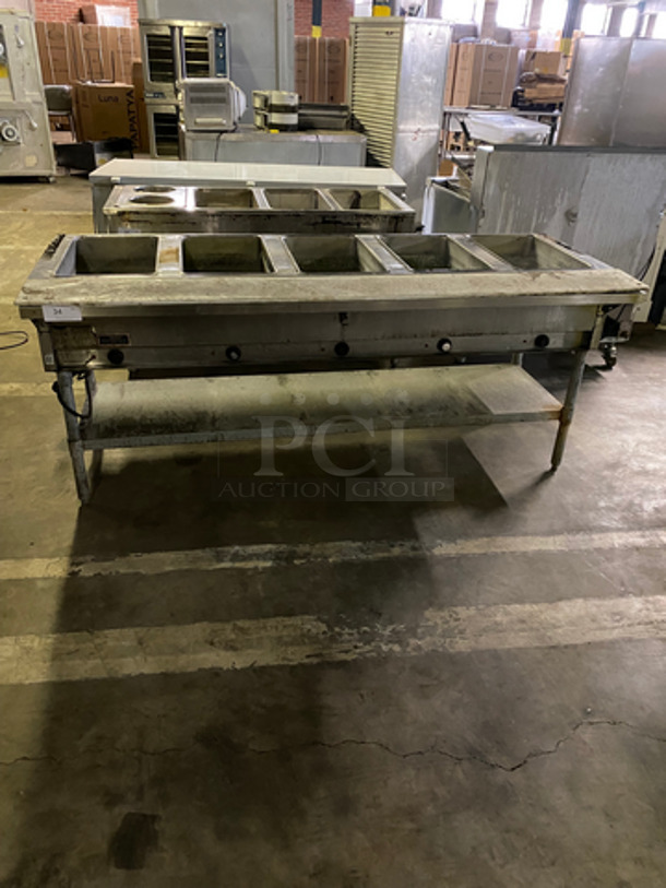 Eagle 4 Well Steam Table! With Storage Shelf Underneath! All Stainless Steel! On Legs! Model: DHT5208 SN: 1004100119 208V 60HZ 1 Phase