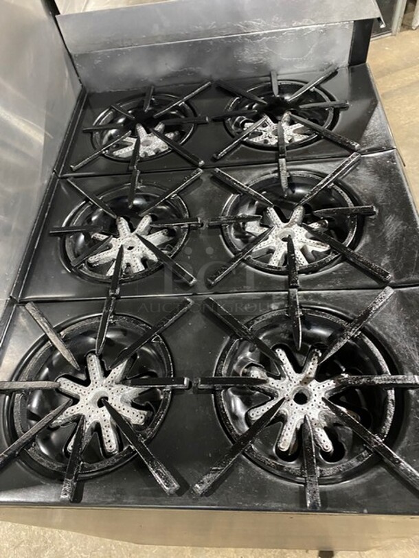 AMAZING! Garland Commercial Natural Gas Powered 6 Burner Split Top With Right Side Flat Griddle! With 2 Full Ovens Underneath! With Back Splash & Overhead Salamander Shelf! All Stainless Steel! With Metal Oven Racks! On Casters!  - Image 5 of 12