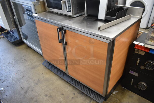 Duke RUF-48 Stainless Steel Commercial 2 Door Work Top Cooler w/ Wood Pattern Doors. 120 Volts, 1 Phase. Tested and Powers On But Does Not Get Cold