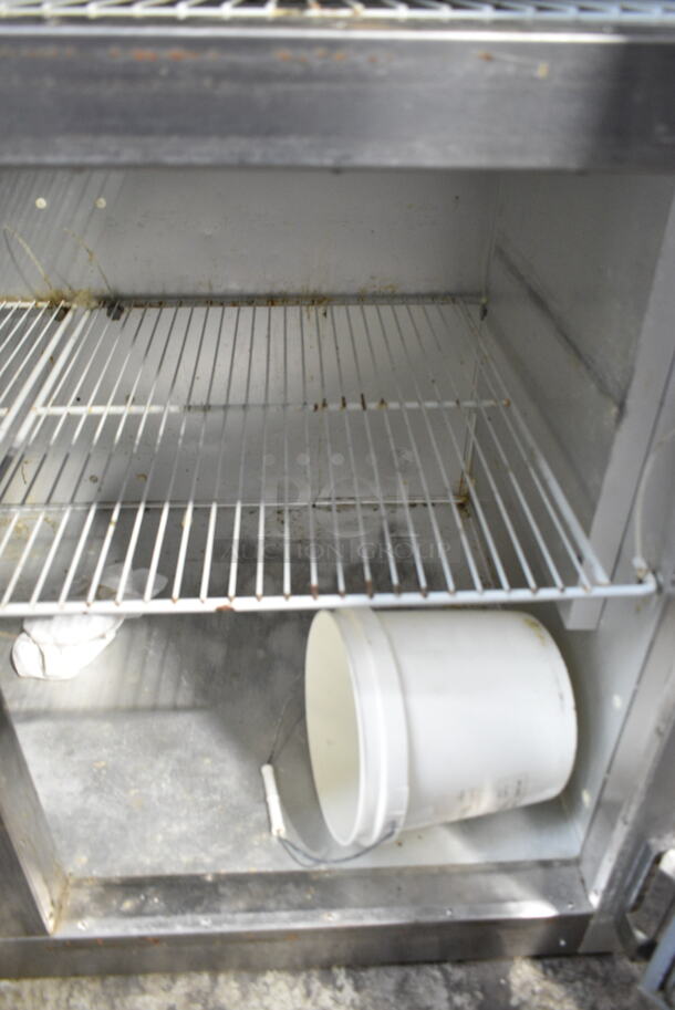 Traulsen G20000 Stainless Steel Commercial 4 Half Size Door Reach In Cooler w/ Poly Coated Racks. 115 Volts, 1 Phase. Tested and Powers On But Does Not Get Cold 
 - Image 5 of 7