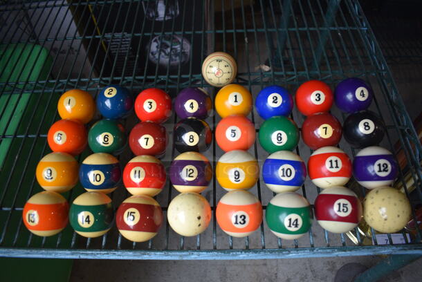 2 Sets of Pool Balls w/ 2 Cue Balls and 1 Training Ball. Goes GREAT w/ Item 6-7, 9! 2.5x2.5x2.5. 2 Times Your Bid!