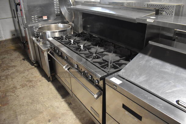 Imperial Commercial Stainless Steel Natural Gas Range With 10  Burners and 2 Ovens With Metal Racks On Commercial Casters.  - Image 3 of 7