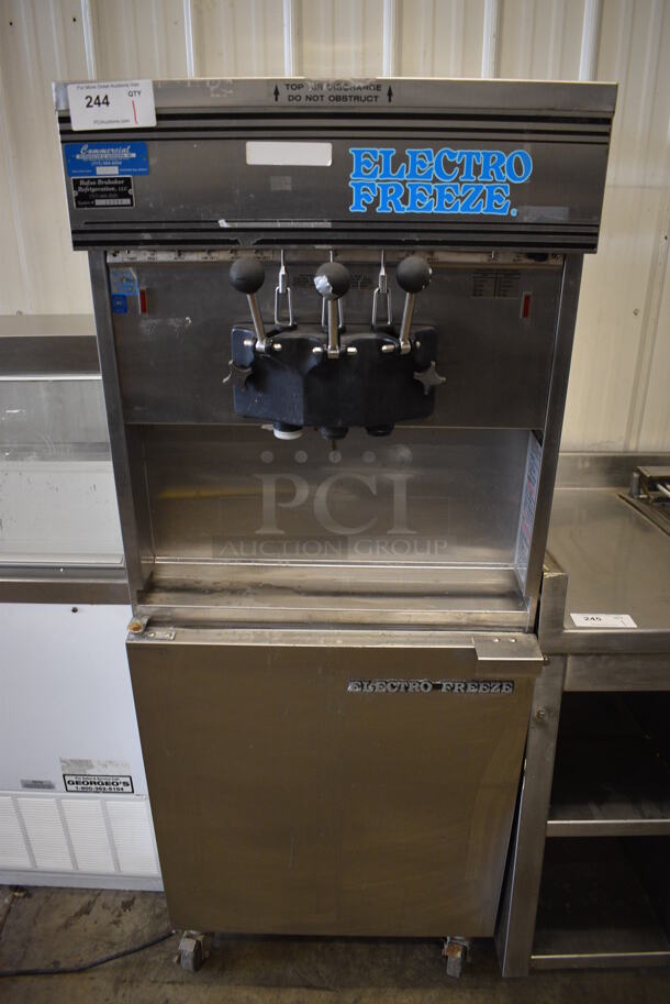 Electro Freeze Model 30TN-CAB-113 Stainless Steel Commercial Water Cooled Floor Style 2 Flavor w/ Twist Soft Serve Ice Cream Machine on Commercial Casters. 230 Volts, 1 Phase. 26x38x68