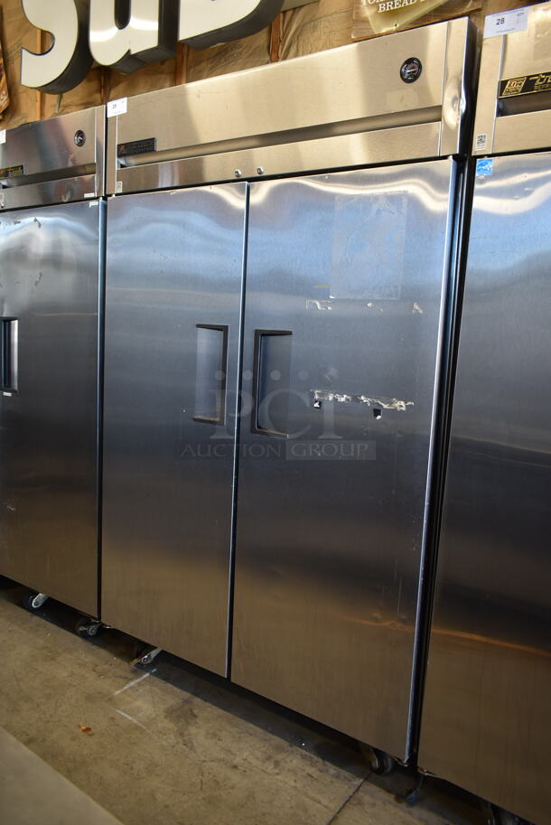 2015 True TG2R-2S ENERGY STAR Stainless Steel Commercial 2 Door Reach In Cooler w/ Poly Coated Racks on Commercial Casters. 115 Volts, 1 Phase. Tested and Working!