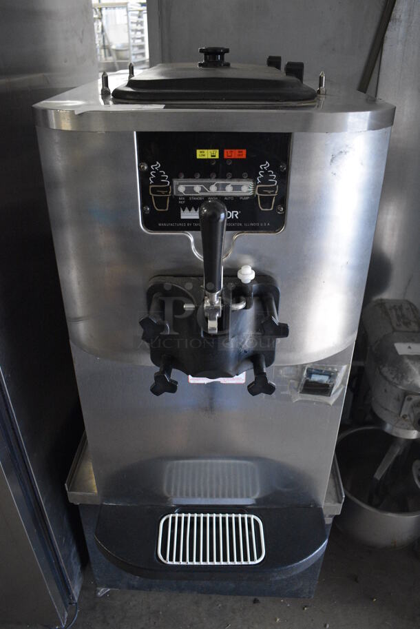 2015 Taylor Model C706-27 Stainless Steel Commercial Air Cooled Single Flavor Soft Serve Ice Cream Machine on Glastender Model MS24-BS(L) Stainless Steel Commercial Stand w/ Commercial Casters. 208-230 Volts, 1 Phase. 18x34x57
