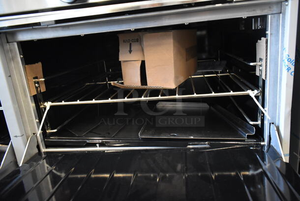 BRAND NEW SCRATCH AND DENT! Garland G60-4G36RR Stainless Steel Commercial Natural Gas Powered 4 Burner Range w/ Flat Top, 2 Ovens, Over Shelf and Back Splash.  - Image 9 of 10