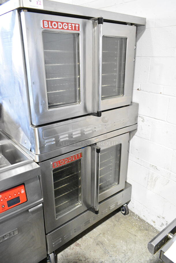 2 Blodgett Stainless Steel Commercial Gas Powered Full Size Convection Oven w/ View Through Doors, Metal Oven Racks and Thermostatic Controls on Commercial Casters. 2 Times Your Bid!  - Image 1 of 11