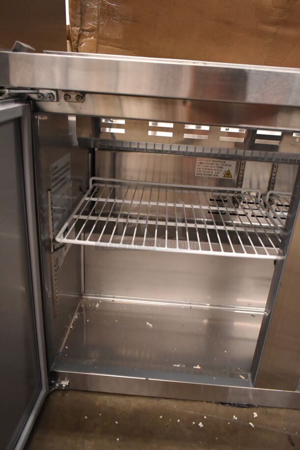 BRAND NEW SCRATCH AND DENT! 2023 Avantco 178SSPT71HC Stainless Steel Commercial Refrigerated Sandwich Prep Table. Missing Door and Top. 115 Volts, 1 Phase. Tested and Powers On But Does Not Get Cold - Image 6 of 7