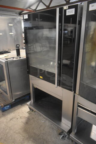 Fri-jado TDR7-P Stainless Steel Commercial Electric Powered 7 Spit Rotisserie Oven w/ Metal Basket Spits on Commercial Casters. 208 Volts, 3 Phase. 