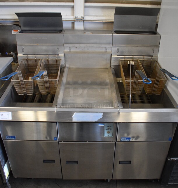 Pitco Frialator Model F14S-V Stainless Steel Commercial Floor Style Propane Gas 2 Bay Fryer w/ Center Dumping Station on Commercial Casters. 110,000 BTU. 49x32x54 - Image 1 of 10