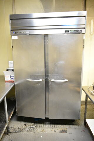 Beverage Air ER48-1AS Stainless Steel Commercial 2 Door Reach In Cooler w/ Poly Coated Racks on Commercial Casters. 115 Volts, 1 Phase. This Unit Was In Working Condition When the Restaurant Closed. (kitchen)