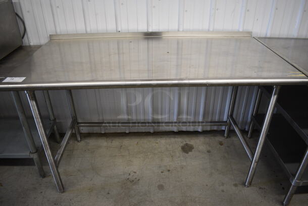 Stainless Steel Table w/ Back Splash. 60x30x37